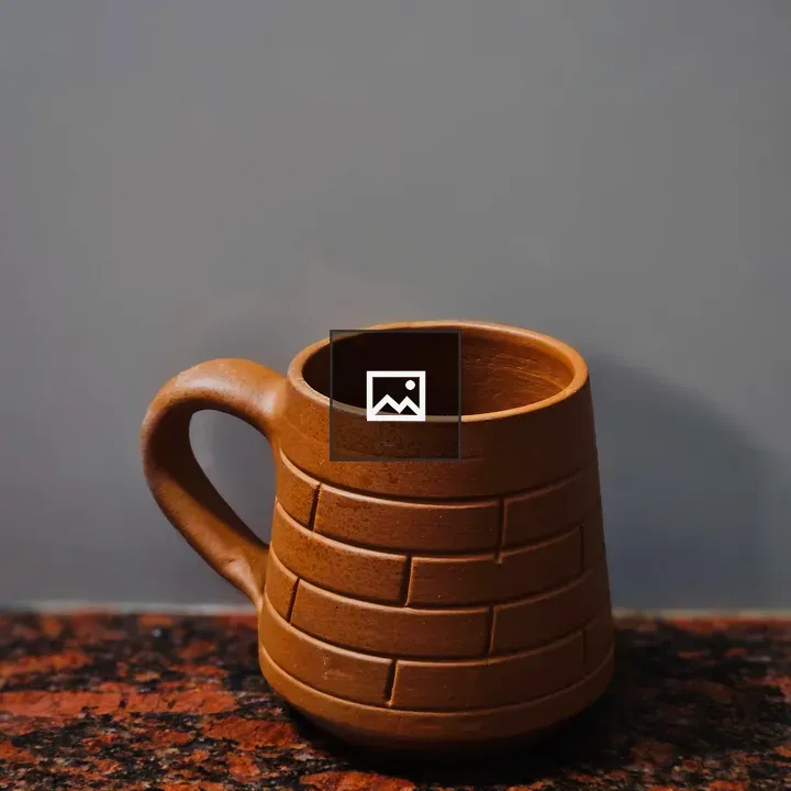 Handcrafted Clay Mug on Counter