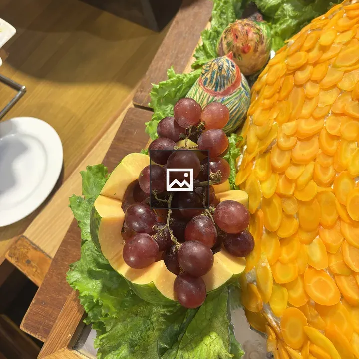 Decorative platter with grapes and melon