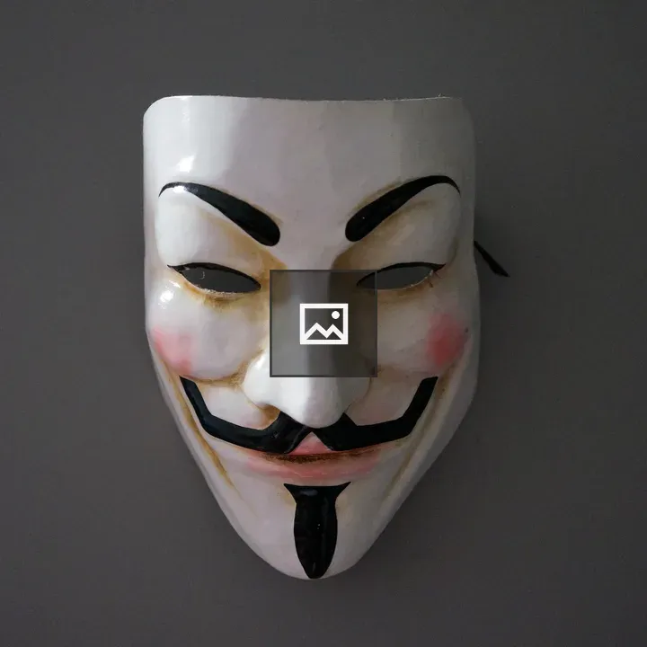 Guy Fawkes Mask on Gray Wall