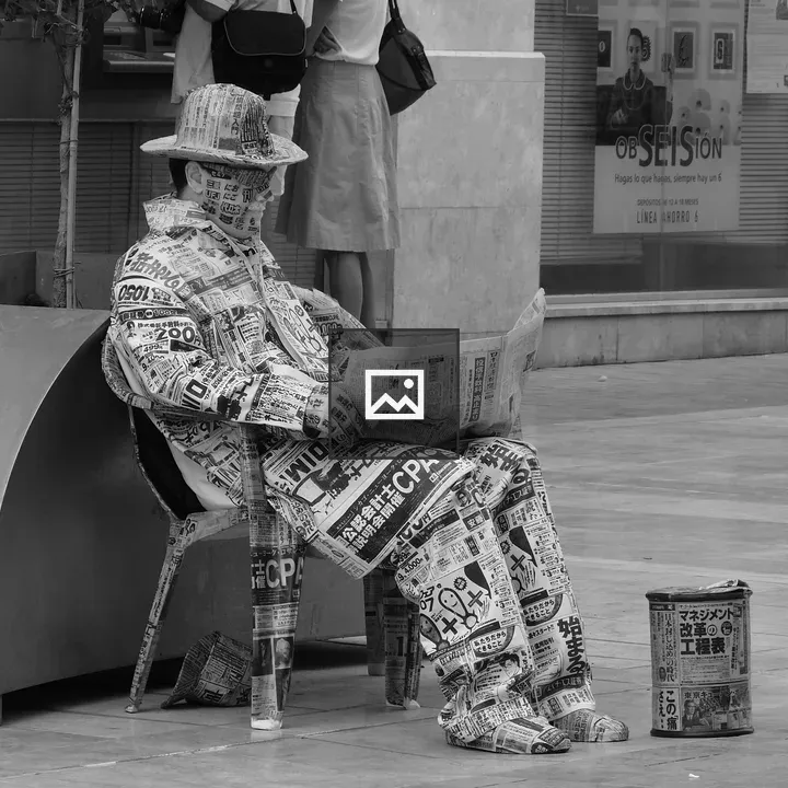 Man with Newspaper-Covered Face