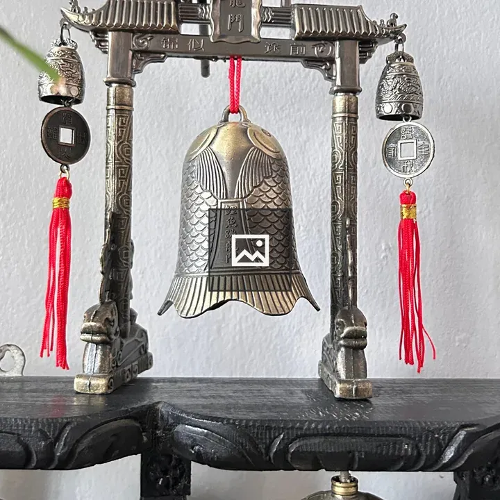 Ornate metal archway with bells