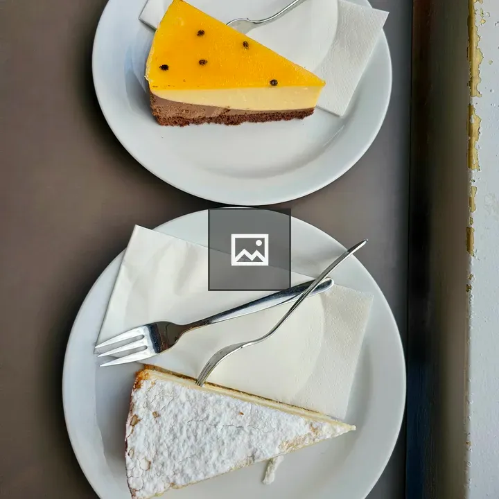 Two Cake Slices on Plates