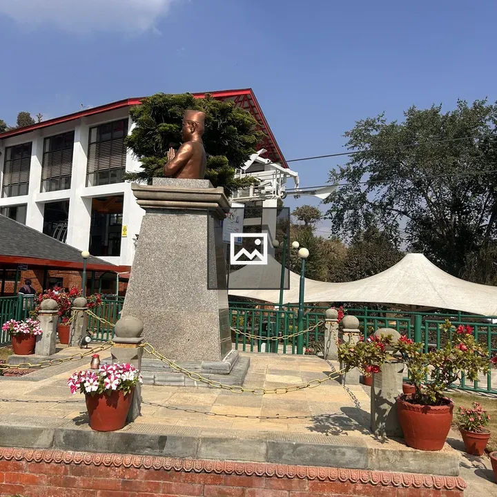 Statue with Potted Plants