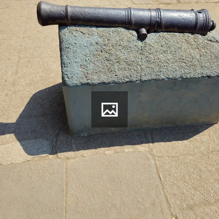 Old iron cannon on pedestal