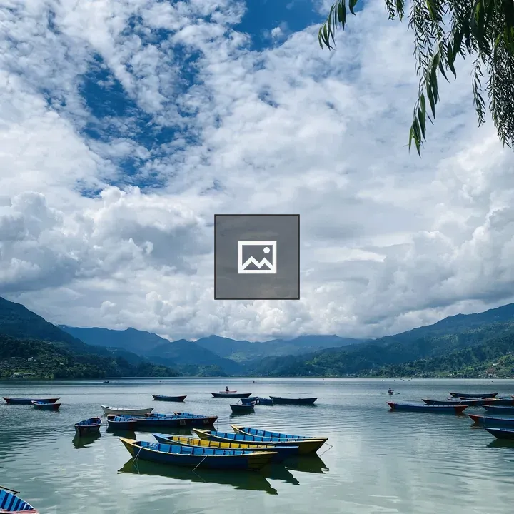 Colorful boats on tranquil lake