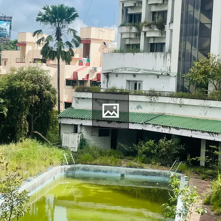 Neglected swimming pool scene