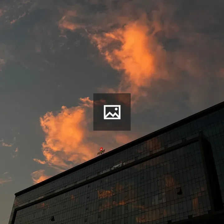 Fire in the sky over city glass