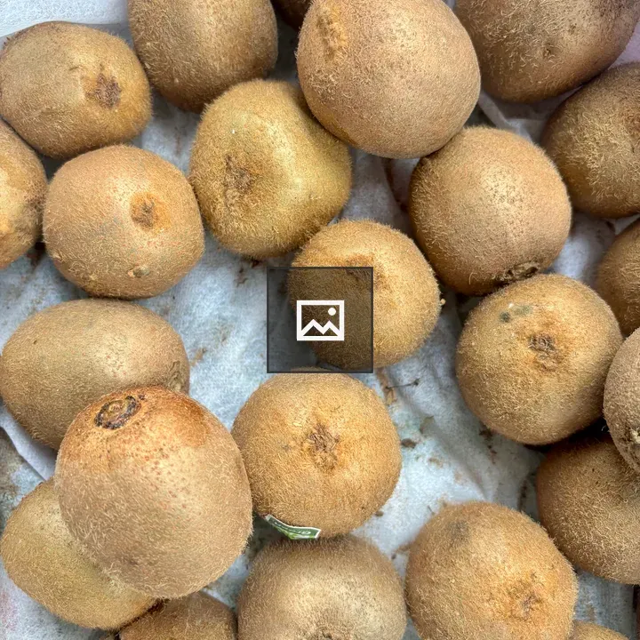 Brown kiwifruits on cloth