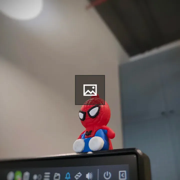 Spiderman action figure on monitor