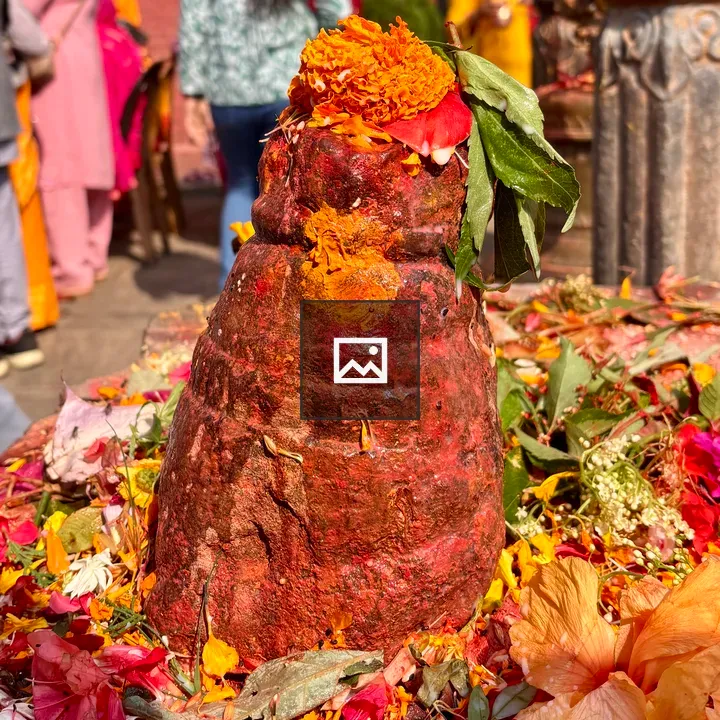 Rust-colored stone with marigolds