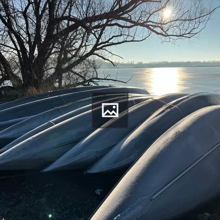 Canoes on a lake at sunrise