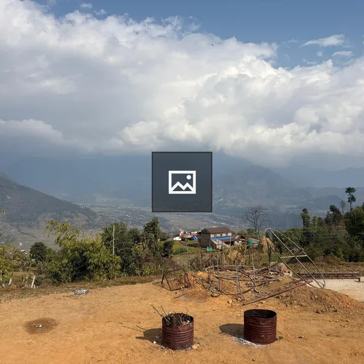 Mountain landscape with rusty barrels