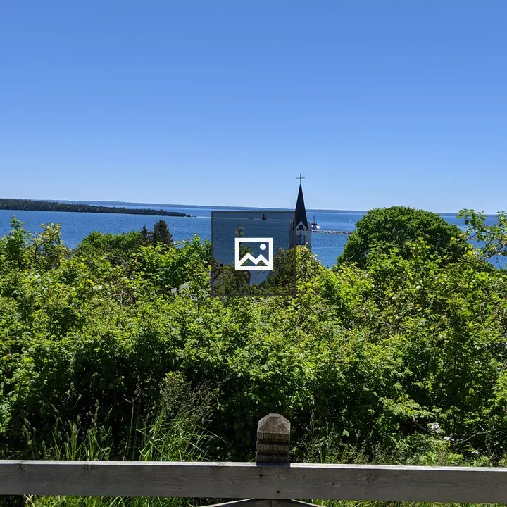 Steeple above the trees on Mackinac Island