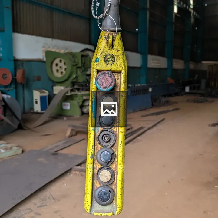 Worn yellow industrial control panel