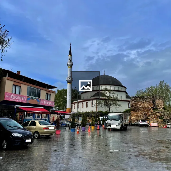 Mosque by blue sky with Roman ruins