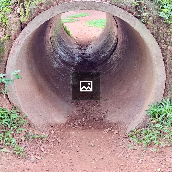 Concrete pipe tunnel play structure
