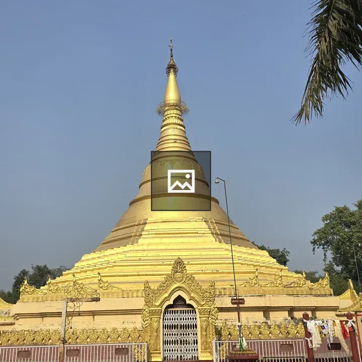Golden stupa against blue sky