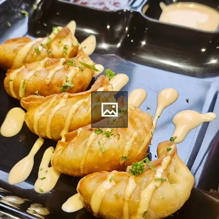 Plate of fried momos with sauce
