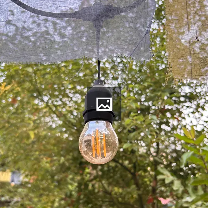 Vintage bulb with fabric and garden