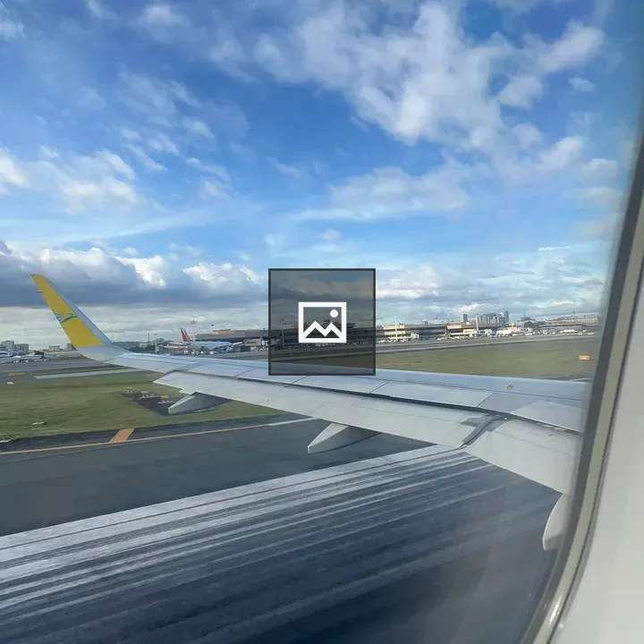 Airplane Wing Over Runway