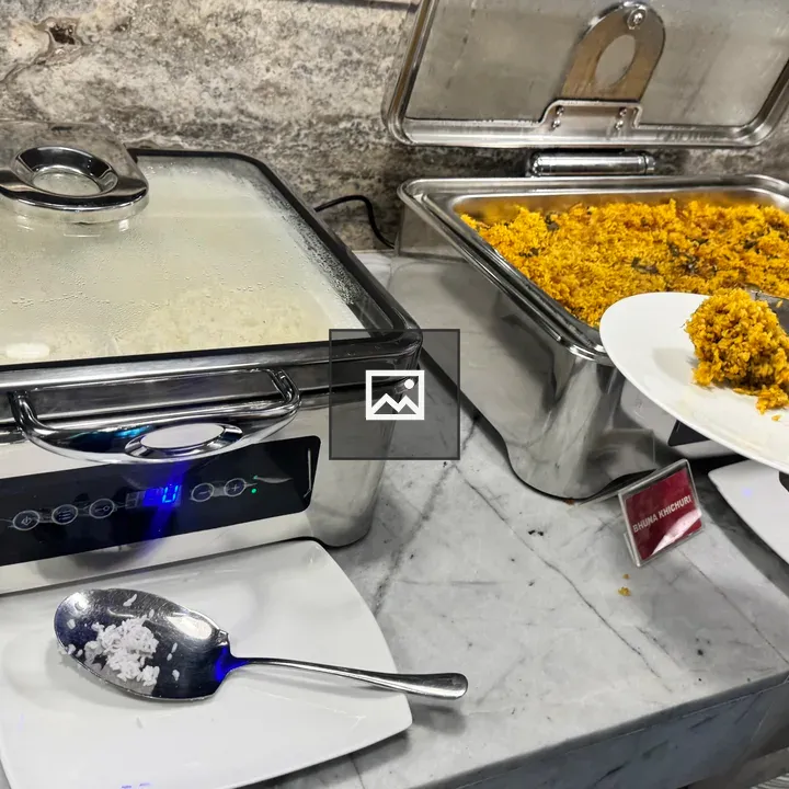 Yellow rice at buffet warmer