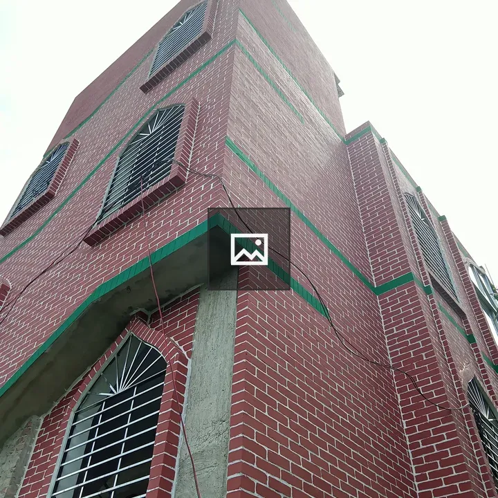 Corner brick building with arched windows