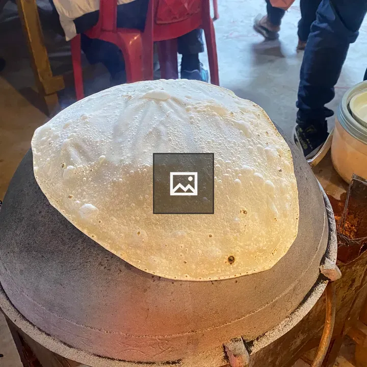 Thin crepe batter on dome griddle