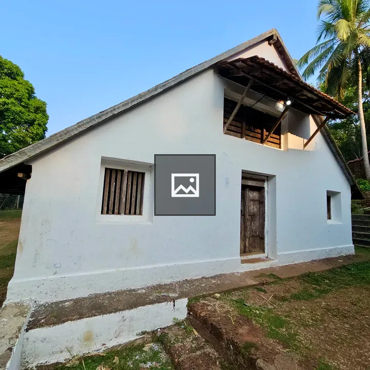 White traditional building with blue roof