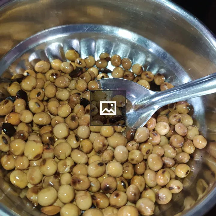 Stainless steel bowl with dried legumes