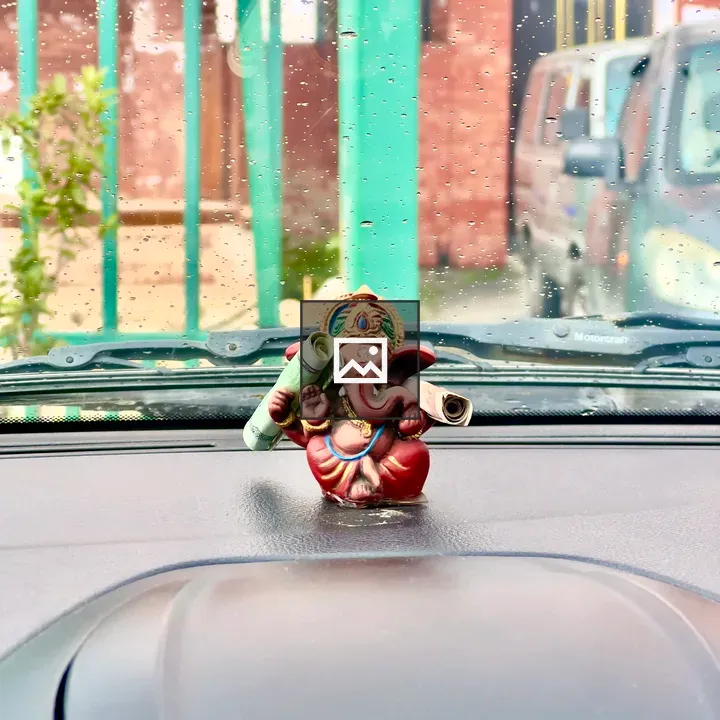 Ganesha idol on car dashboard