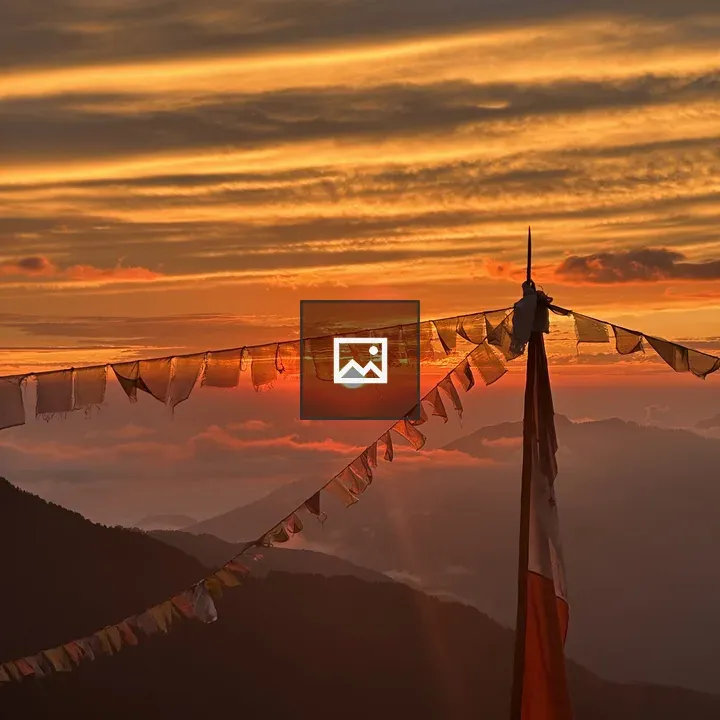Prayer flags silhouette at sunrise