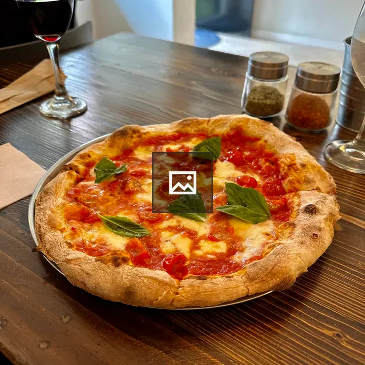 Pizza Margherita on Wood Table