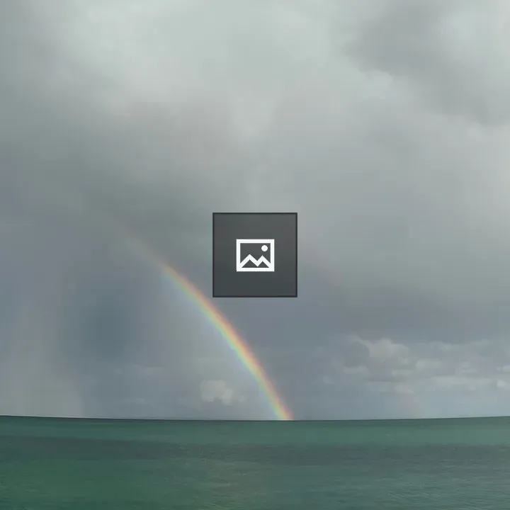 Rainbow in a storm over Lake Huron
