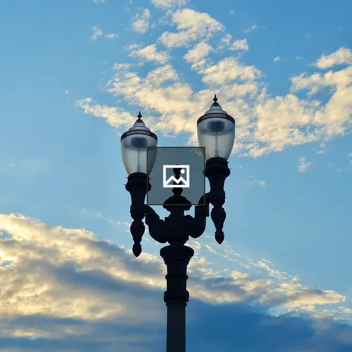 Vintage lamppost against blue sky