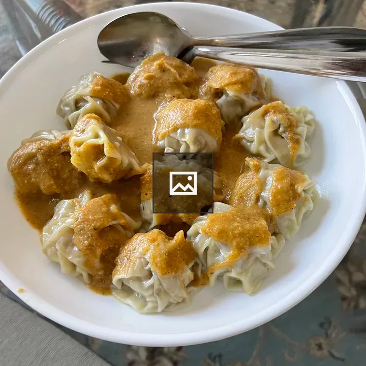 Plate of dumplings with orange glaze