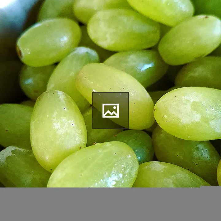Fresh green grapes in bowl