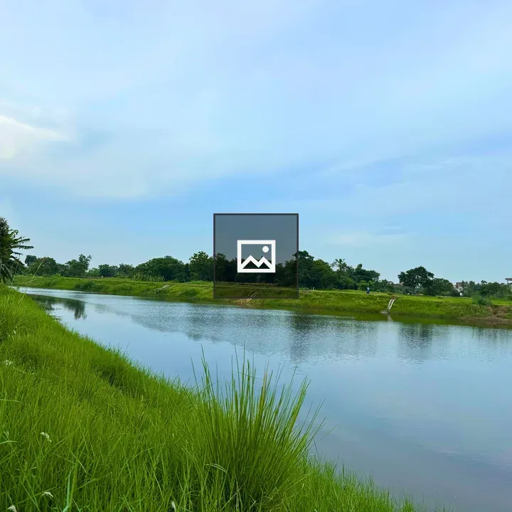 Calm lake with green grass and banana trees