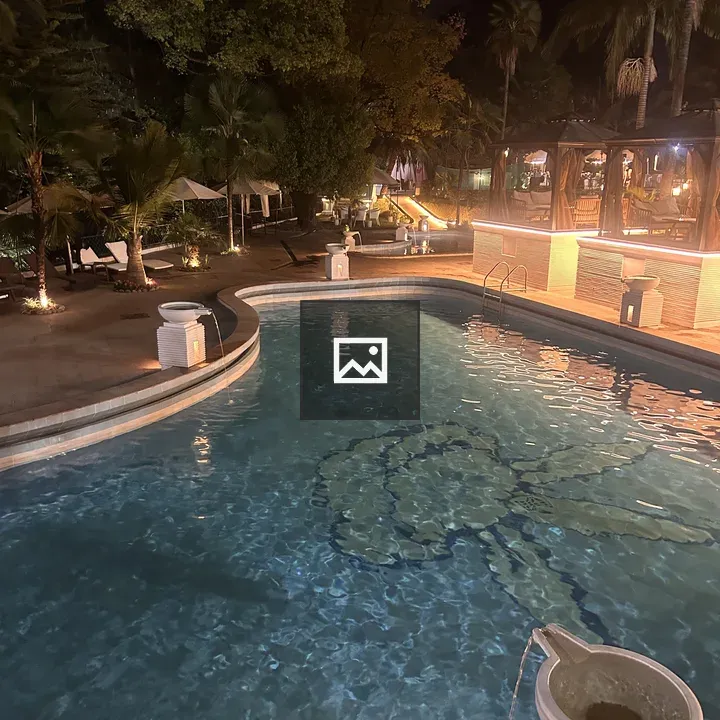 Nighttime pool with decorative floor
