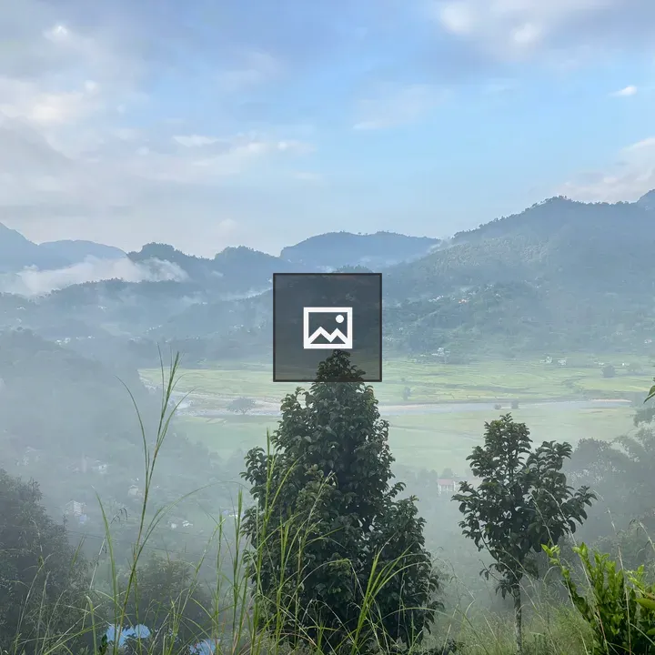 Mist-enshrouded hills landscape