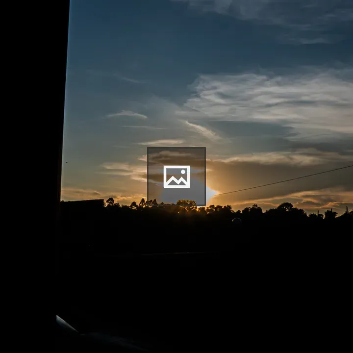 Wide golden-hour landscape with silhouettes
