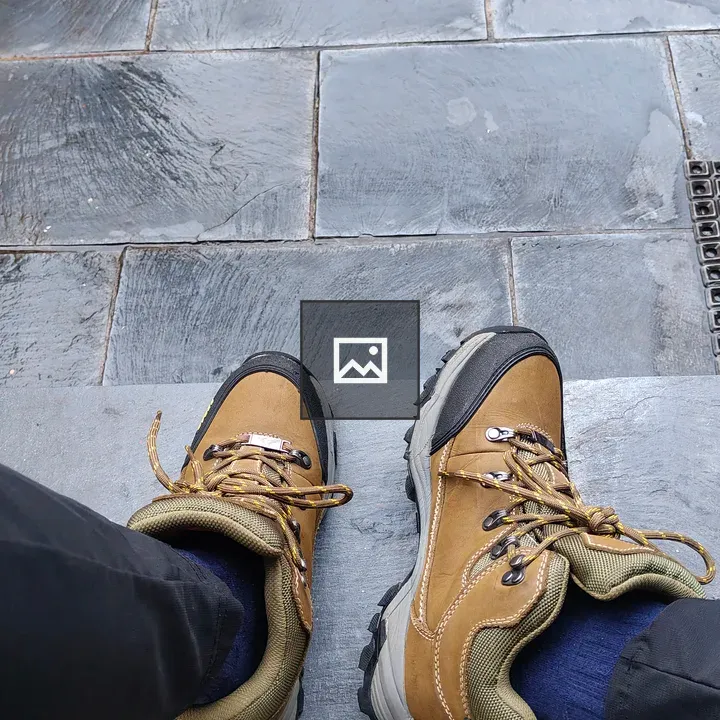 Brown hiking boots on steps