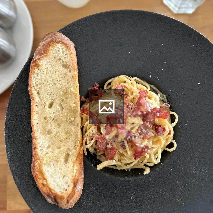 Spaghetti with Crispy Bacon on Plate