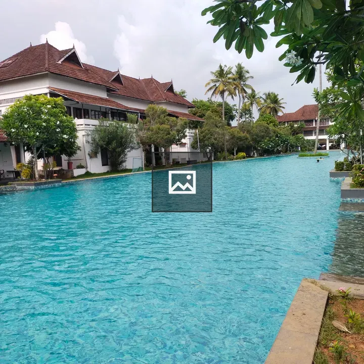 Swimming pool along white buildings