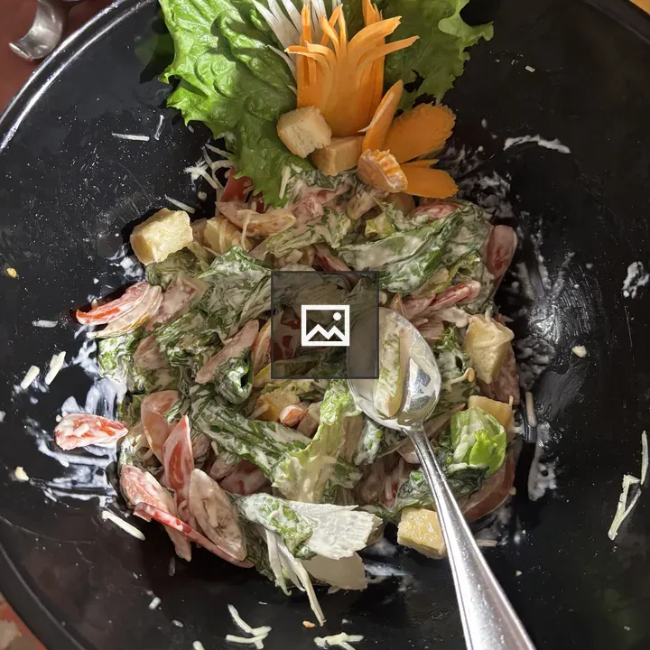 Salad in Black Bowl