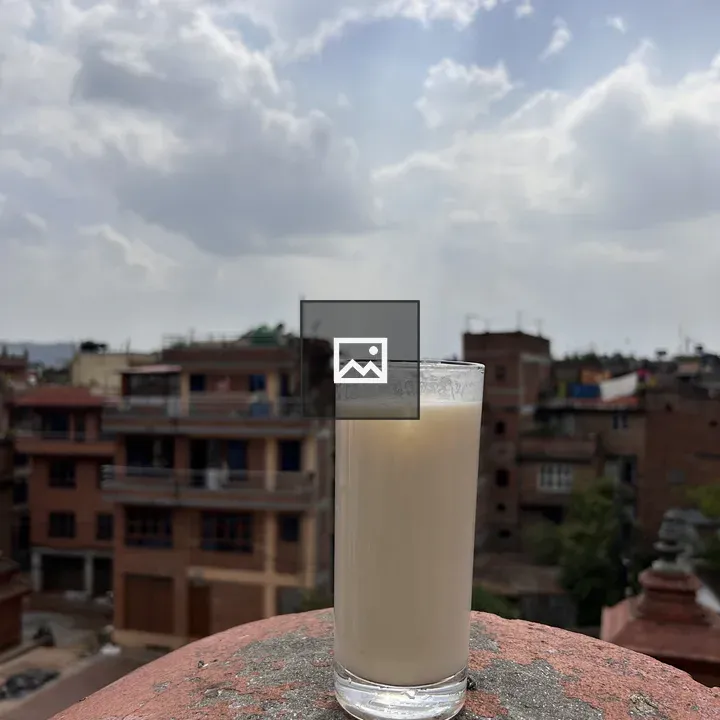 Glass of light-colored beverage