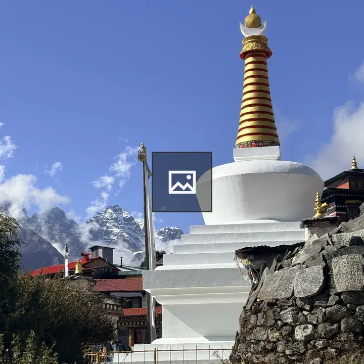 Stupa with Golden Dome in Rocky Terrain