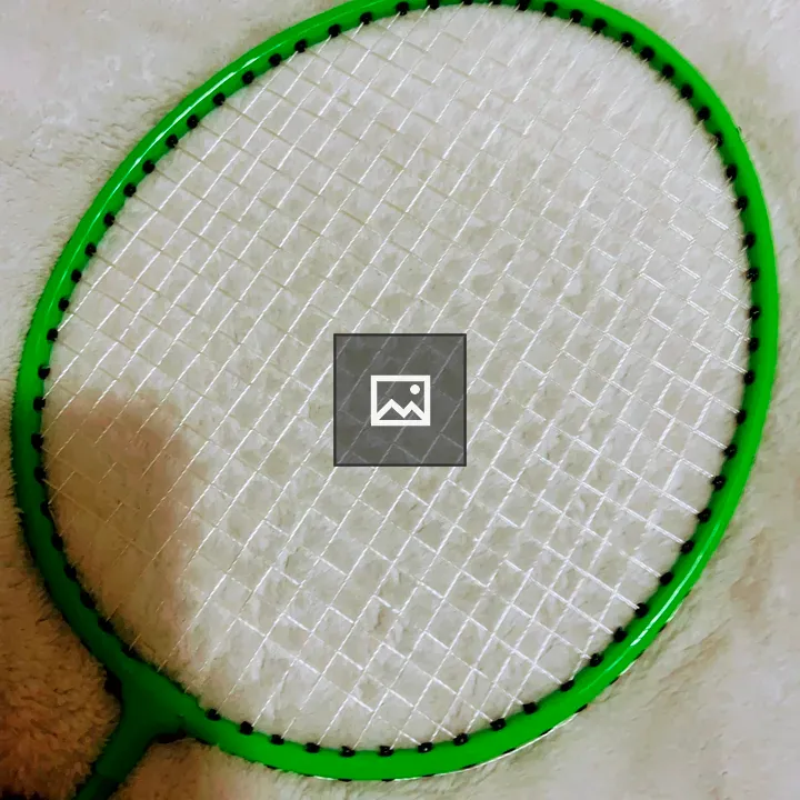 Badminton racket on white surface