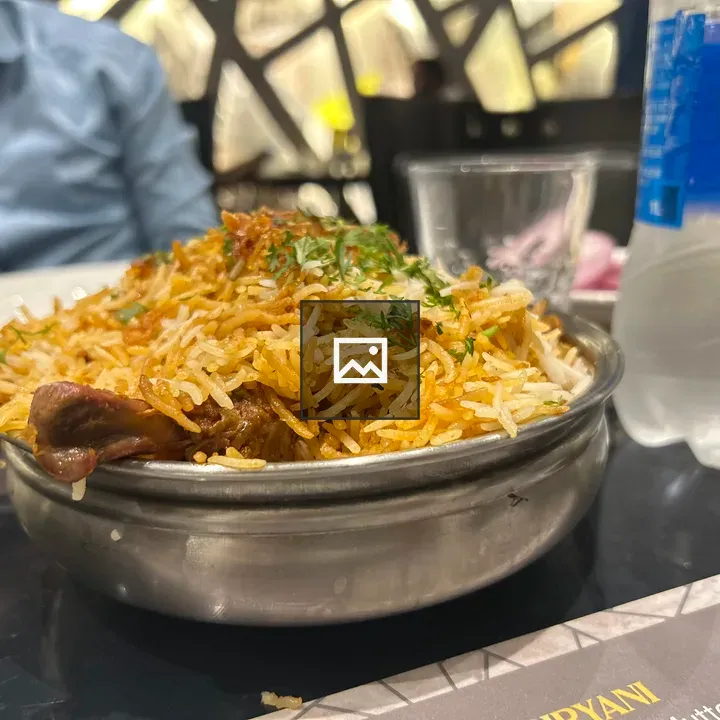 Bowl of biryani with herbs