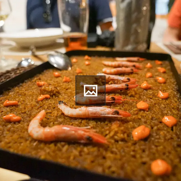 Rice dish with prawns in pan