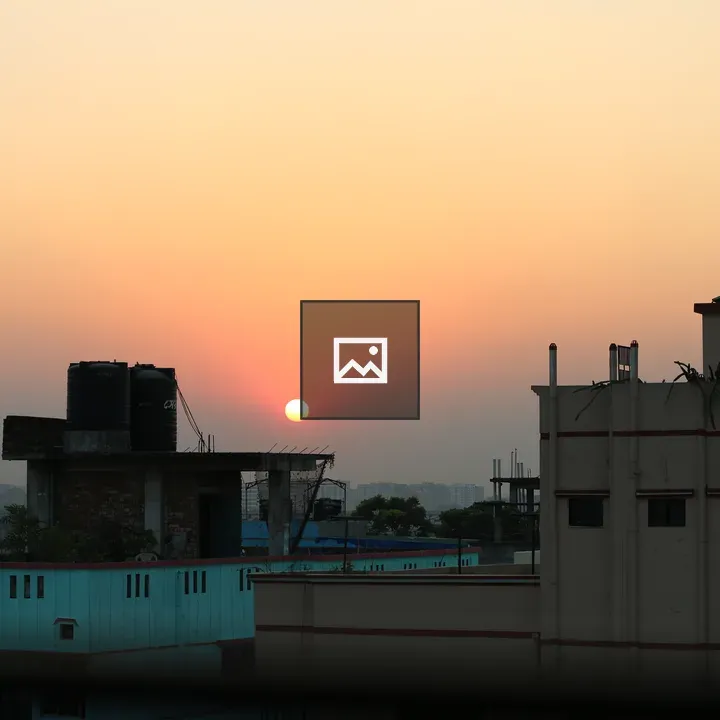 Sunset over city rooftops